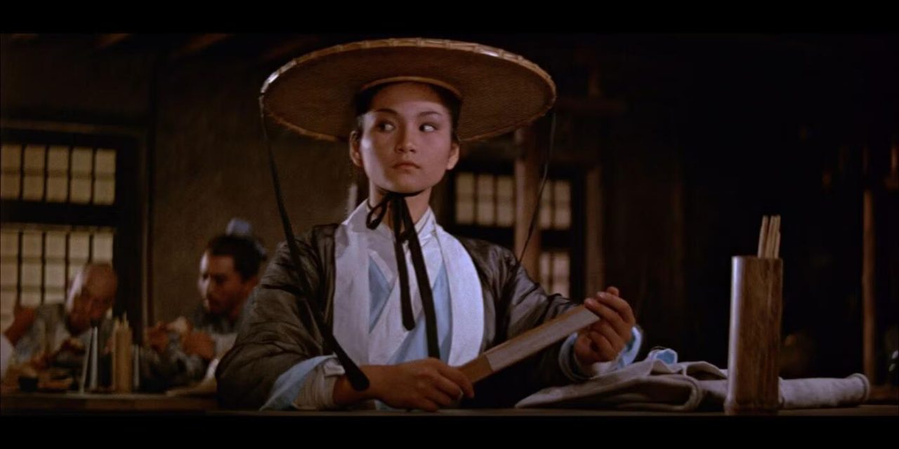 a woman holding a scroll in her hand in come drink with me فیلم come drink with me